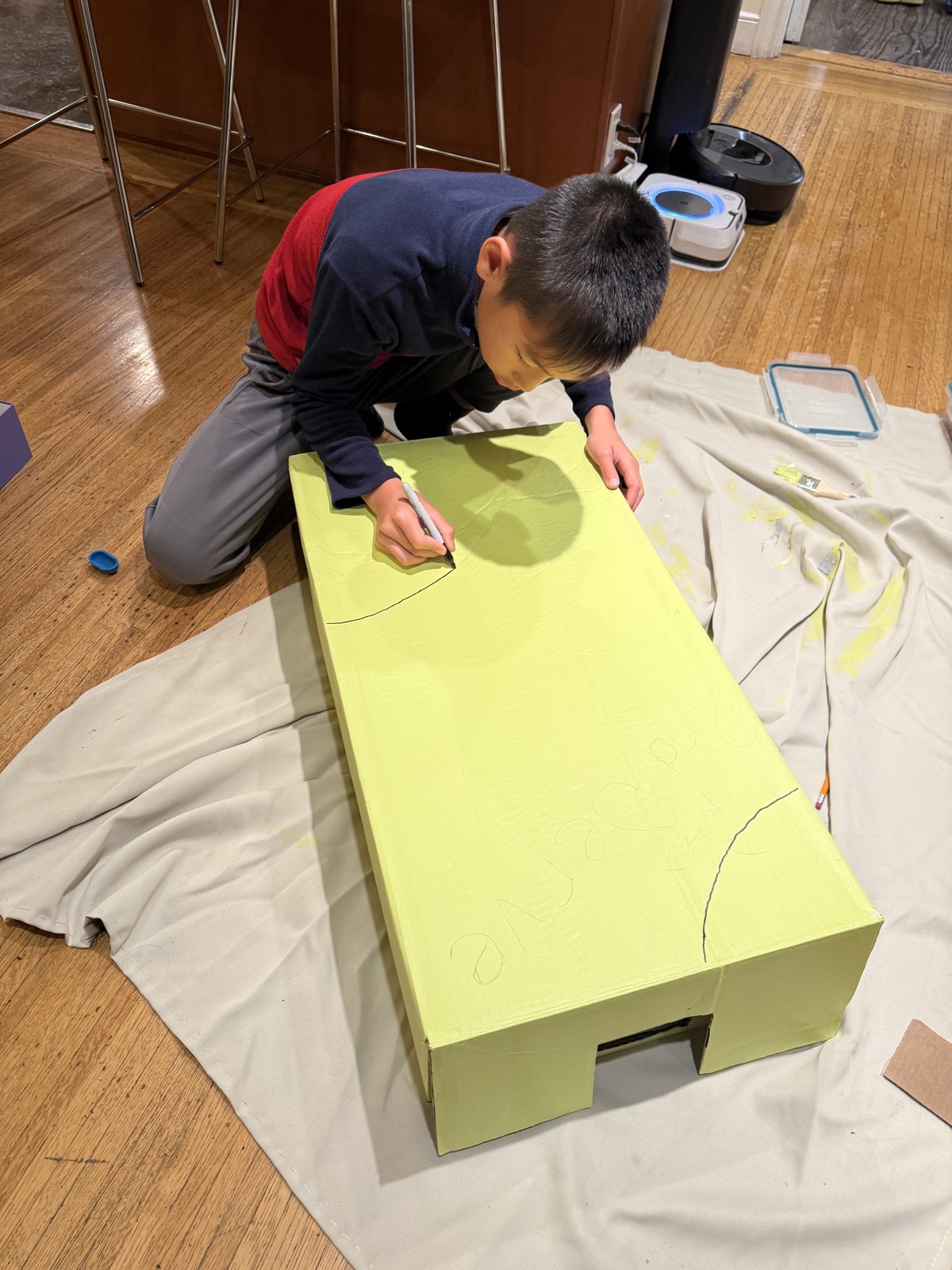 Bin filled with collected tennis balls.